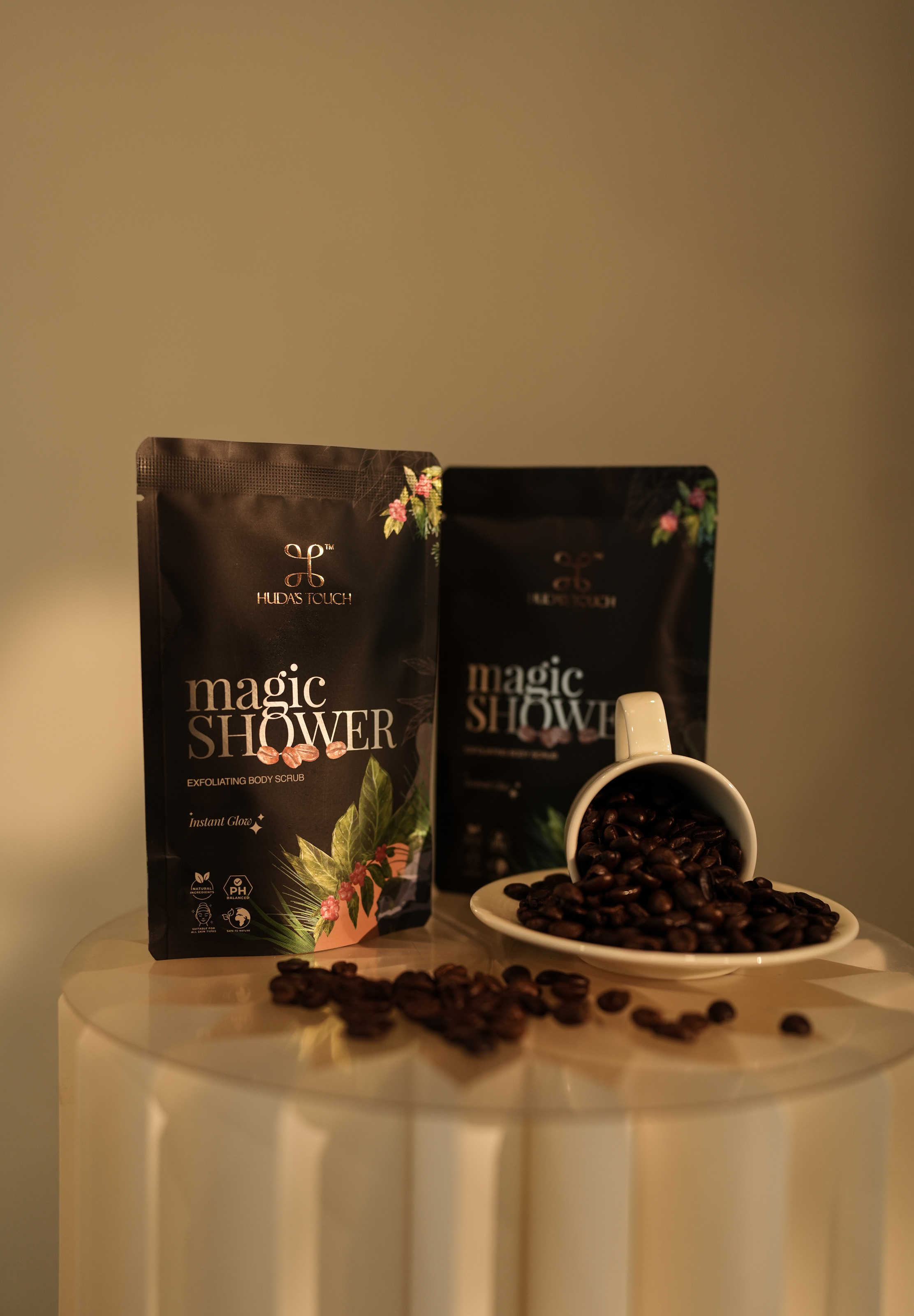 Front and back of the sachet beside a cup of beans
